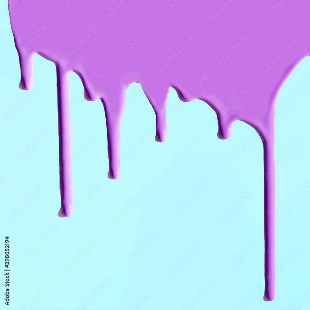 Pouring purple paint on neo mint or blue. Creative pattern with copy space.