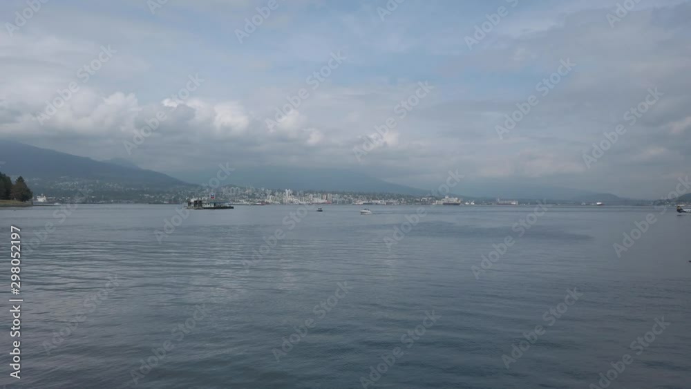 View of the vancouver harbour in afternoon with cloudy sky in summer time View of the vancouver harbour in afternoon with cloudy sky in summer time