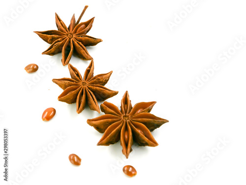 Cinnamon flawers have seeds beside,isolated on a white barkground. photo