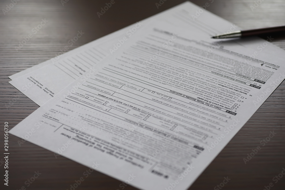 Business meeting. A man signs a contract. Male hand with pen makes notes in the office. Business meeting. A man signs a contract. Male hand with pen makes notes in the office.