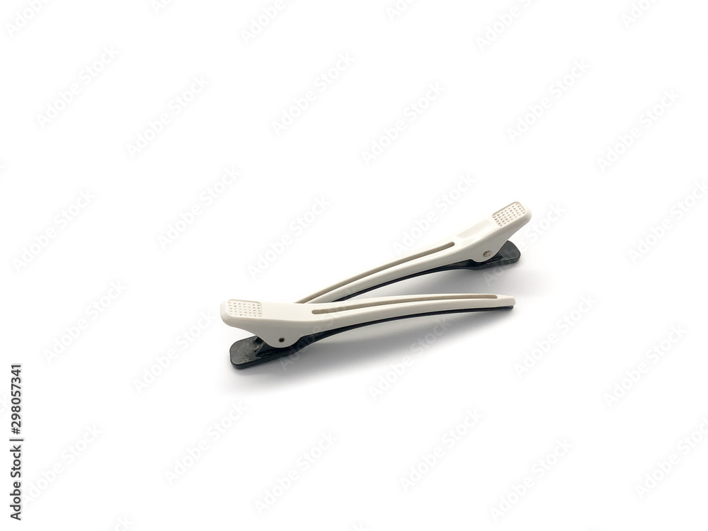 Black with white real hairdresser hair clip isolated on a white background. Black with white real hairdresser hair clip isolated on a white background.