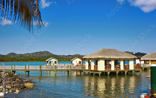Fototapeta Naklejka Na Ścianę i Meble -  Cabanas on the water in luxury tropical resort on sunny day