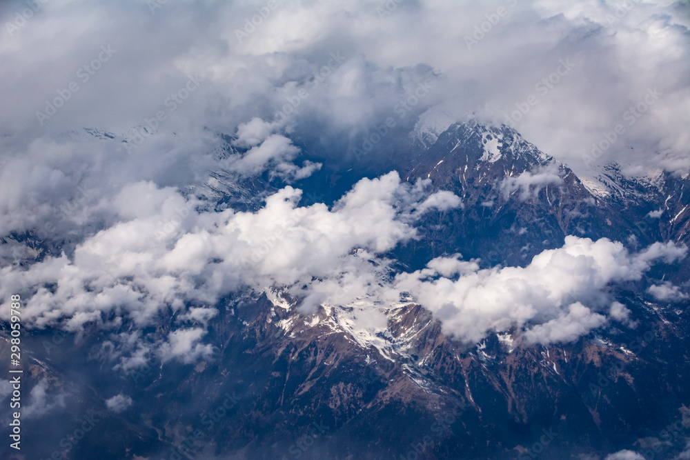 view on white clouds and land from above view on white clouds and land from above