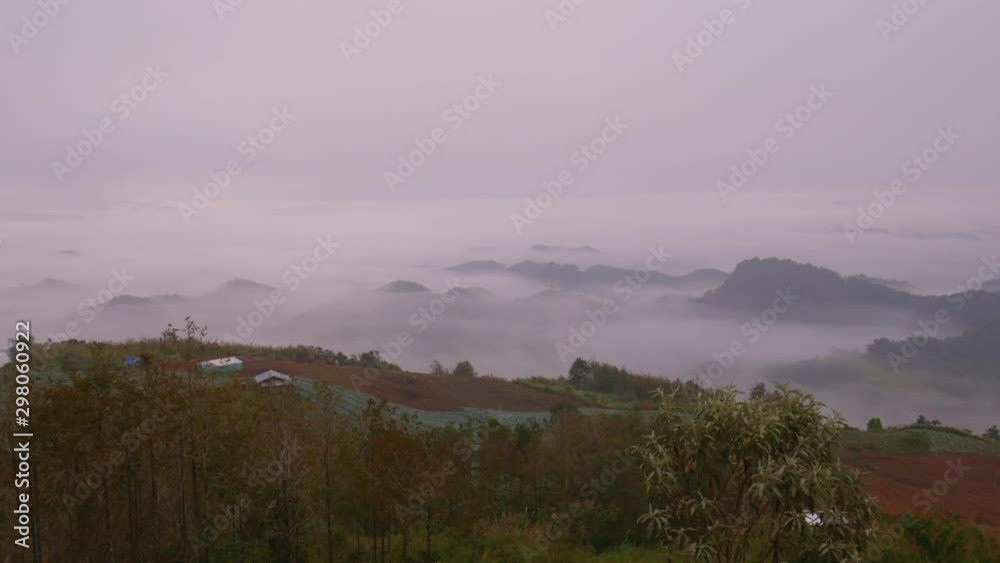 Times lapse of fog or mist is moving over the layer of mountain during sunrise in the forest. Times lapse of fog or mist is moving over the layer of mountain during sunrise in the forest.