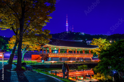 Namsangol traditional village and seoul tower in autumn color at night ,south korea.