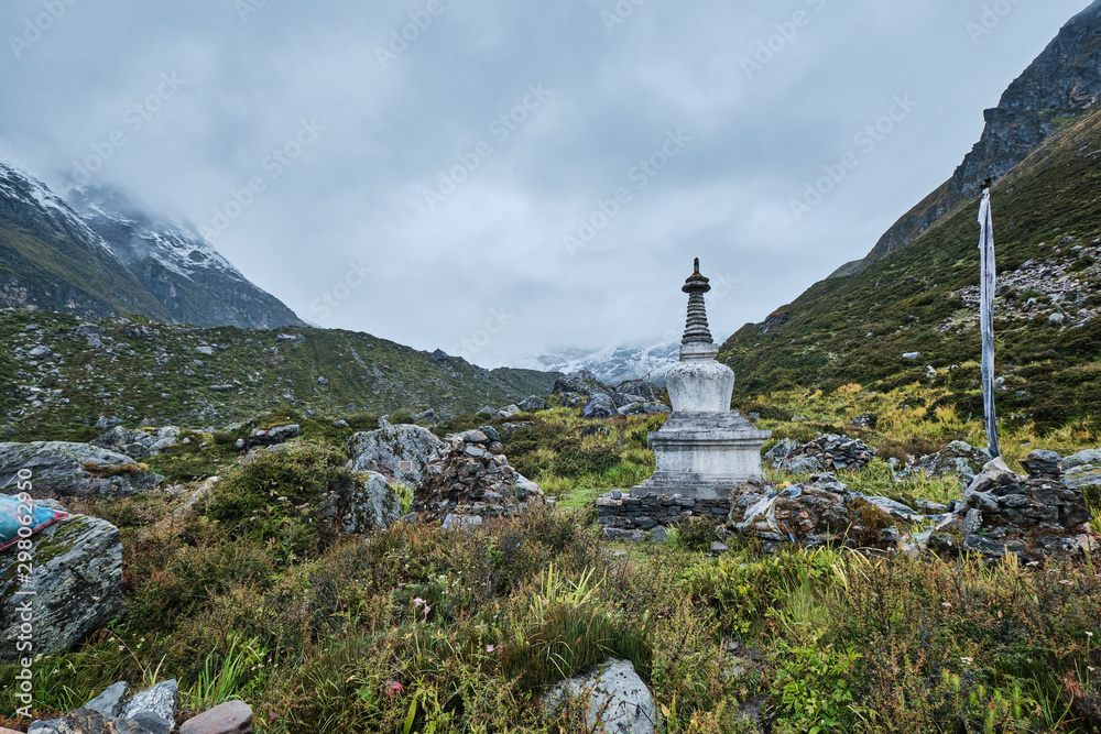 Fototapeta premium Stupa, fog and mountains