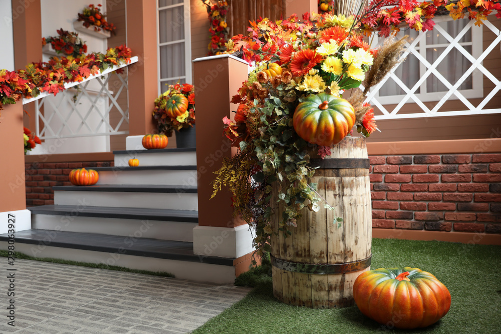 Festive composition near house entrance decorated for traditional autumn holidays