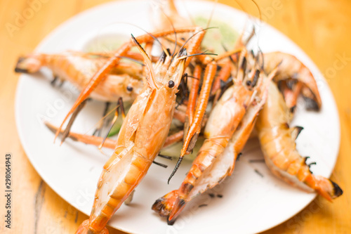  Grilled Tiger Prawns on dish with  cucumber photo