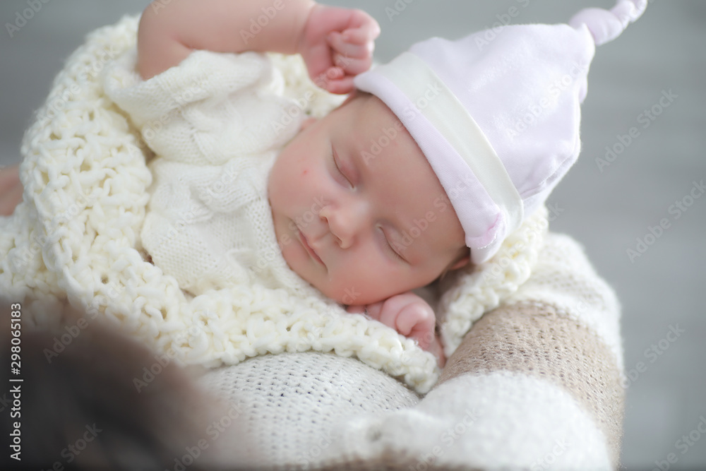 Baby newborn sleeping wrapped up in a blanket Baby newborn sleeping wrapped up in a blanket