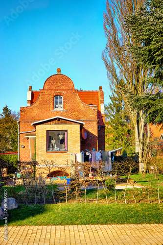 Historic german house with laundry on the clothesline in the front yard. photo
