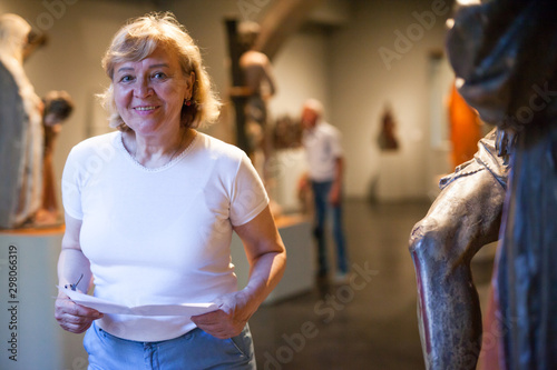 Woman with guidebook at Museum
