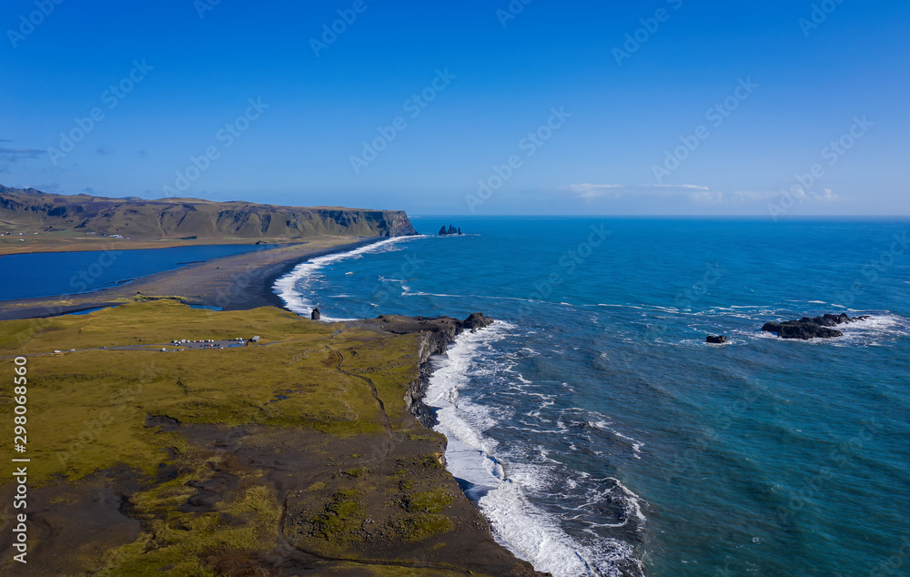 Reynisfjara Black Sand Beach, South Coast Iceland. View from dyrolaey. Panorama. Afternoon. Aerial drone shot, september 2019