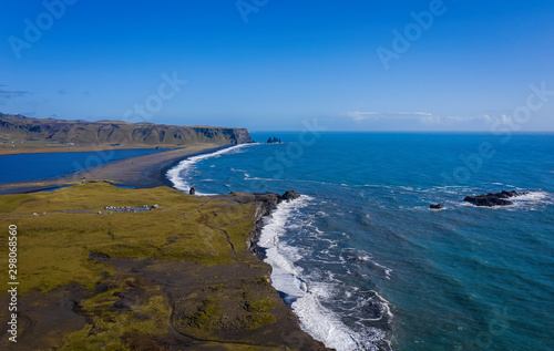 Reynisfjara Black Sand Beach, South Coast Iceland. View from dyrolaey. Panorama. Afternoon. Aerial drone shot, september 2019