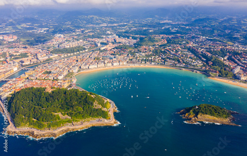 High view of San-Sebastian with Beach of La Concha and boats at sea