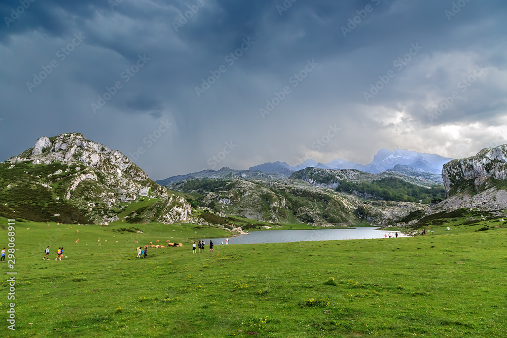 Covadonga, Spain. Tourists on the shore of Lake Ercina