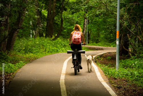 Wallpaper Mural Sporty blonde in the Park on a bike Torontodigital.ca