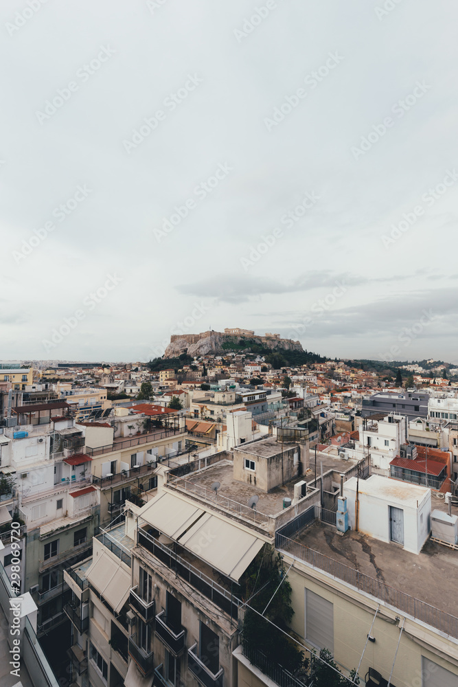Acropolis and old city in Athens in a cloudy day