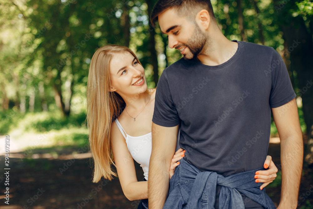 Couple in a forest. Beautiful blonde with her boyfriend Couple in a forest. Beautiful blonde with her boyfriend