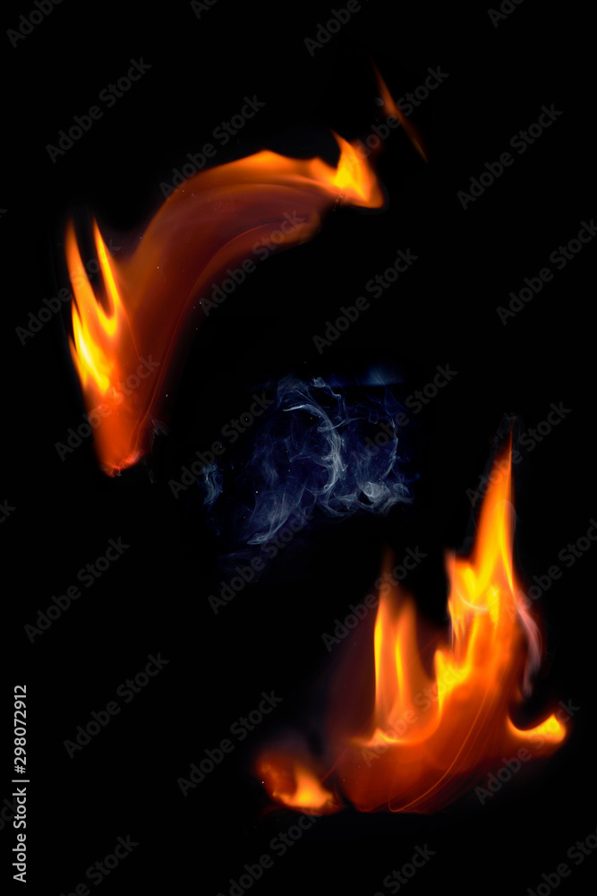 Fototapeta premium Fire flames and smoke isolated on black background