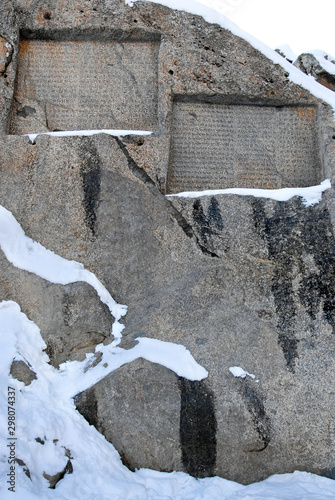 Cuneiform rock carvings in Ganjnameh (near by Hamadan), Iran. photo