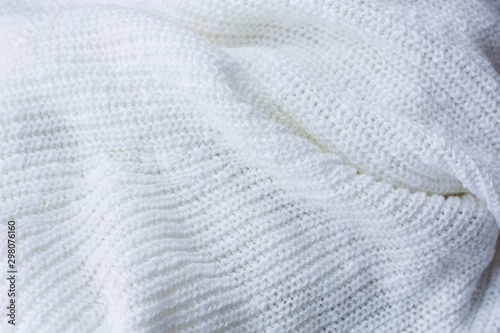 Beautiful knitted white sweater close up view