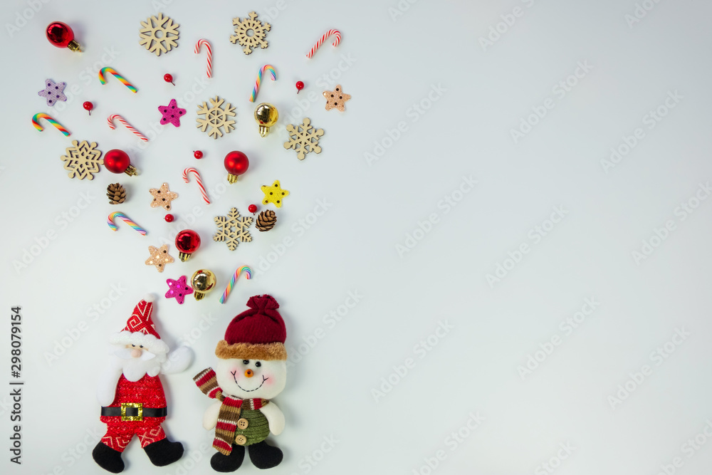 Christmas background concept.Top view of santa claus and snowman splash out christmas decoration with candy cane, snowflake, star and colorful ball on white background with copy space for text.
