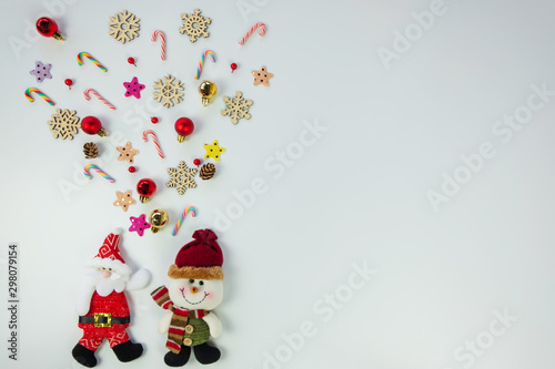 Christmas background concept.Top view of santa claus and snowman splash out christmas decoration with candy cane, snowflake, star and colorful ball on white background with copy space for text.
