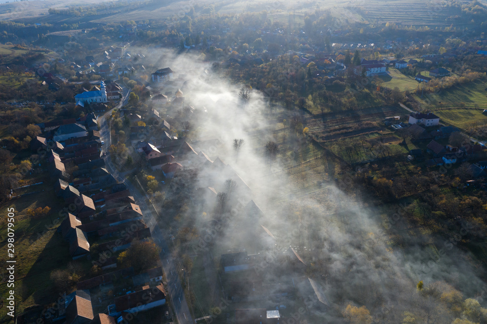 Aerial view of morning haze over a village