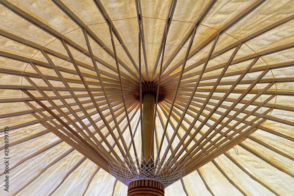 View inside traditional umbrella while open, Wooden frame and natural color mulberry paper, Traditional handicrafts of northern in thailand.