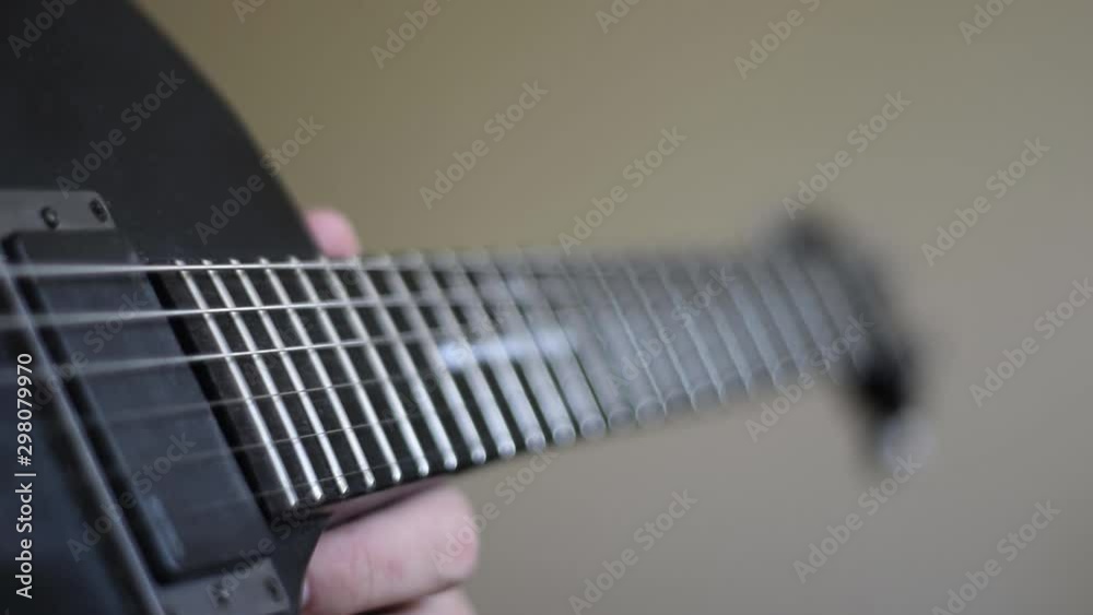 man playing on guitar close up man playing on guitar close up