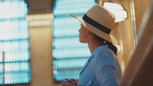 Young photographer takes a photo in the Central Grand Terminal