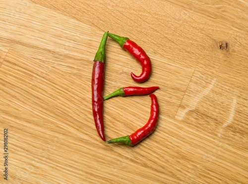 Fototapeta Naklejka Na Ścianę i Meble -  Food letters made from freshly picked chilli peppers