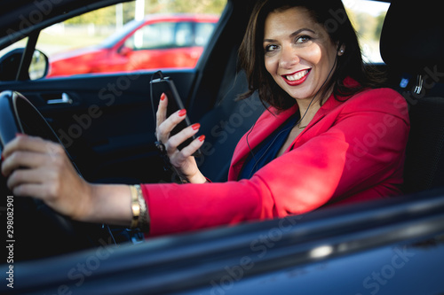 Beautiful business woman in red suit ready for trip.Stock photo © romul014