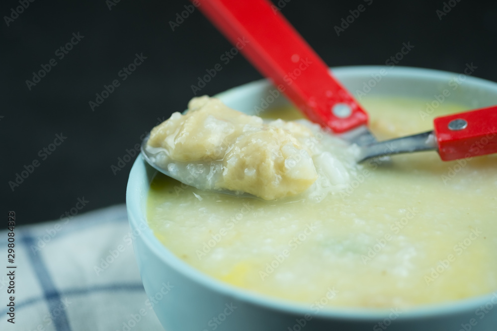 Eating rice gruel mix with raw egg with minced pork in the morning Eating rice gruel mix with raw egg with minced pork in the morning