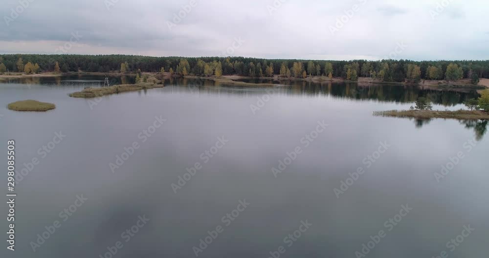 Drone aerial video clear ponds with mirror surface of pure water on outskirts of transparent filled with fresh water surrounded by dense green forest Concept outdoor nature. Drone aerial video clear ponds with mirror surface of pure water on outskirts of transparent filled with fresh water surrounded by dense green forest Concept outdoor nature.