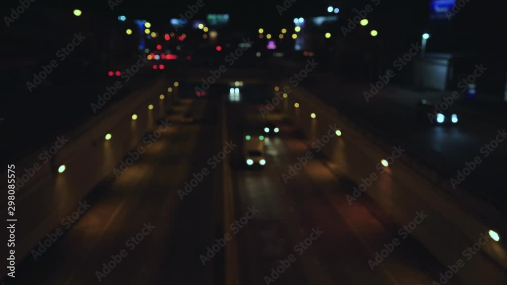 Traffic lights, night traffic that blur,Beautiful glittering bokeh in dark blurry background at night. Traffic lights, night traffic that blur,Beautiful glittering bokeh in dark blurry background at night.