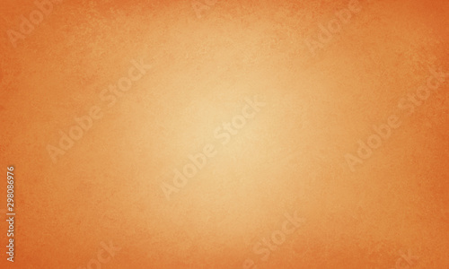orange autumn thanksgiving background with vintage texture with soft yellow center, elegant fall halloween background