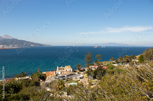 View of the sea and sea port from the top of a hill on a sunny summer day