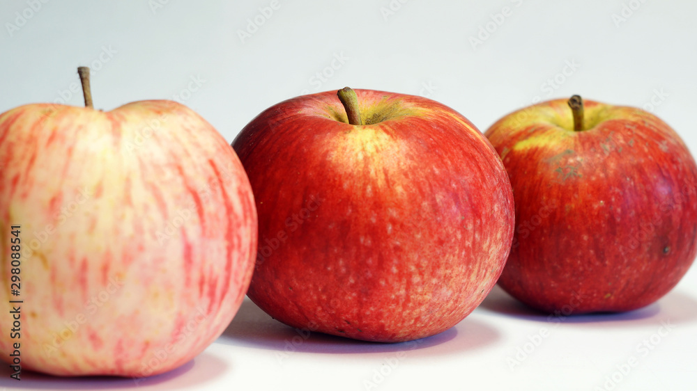 three apples on a light background three apples on a light background