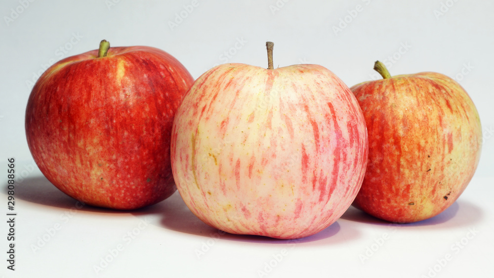 three ripe juicy red-yellow apples three ripe juicy red-yellow apples