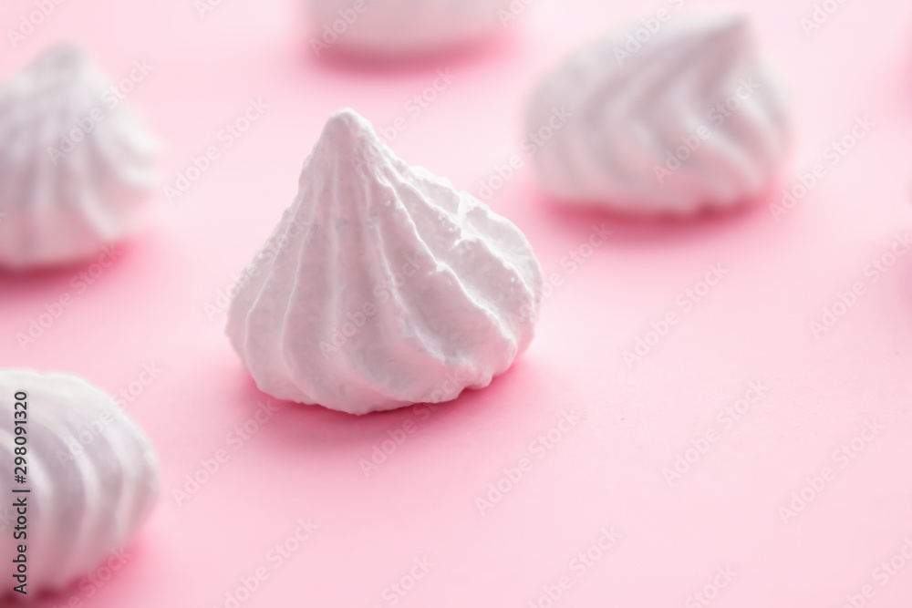 White meringue cookies on pink pastel background White meringue cookies on pink pastel background