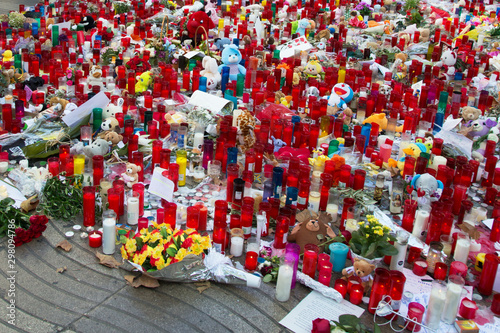 Huge amount of candles, toys and flowers outdoors in memory of victims of terrorists attack in Barcelona 2017