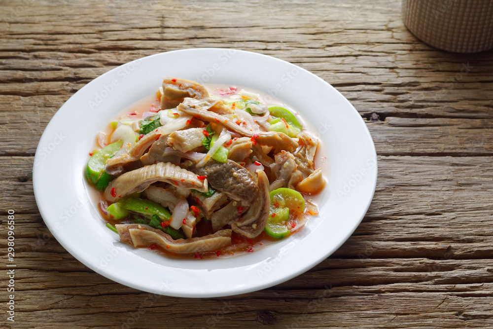 Thai food,Spicy salad boiled pig stomach with cucumber and Shallot mixed with spicy sauce Thai food,Spicy salad boiled pig stomach with cucumber and Shallot mixed with spicy sauce
