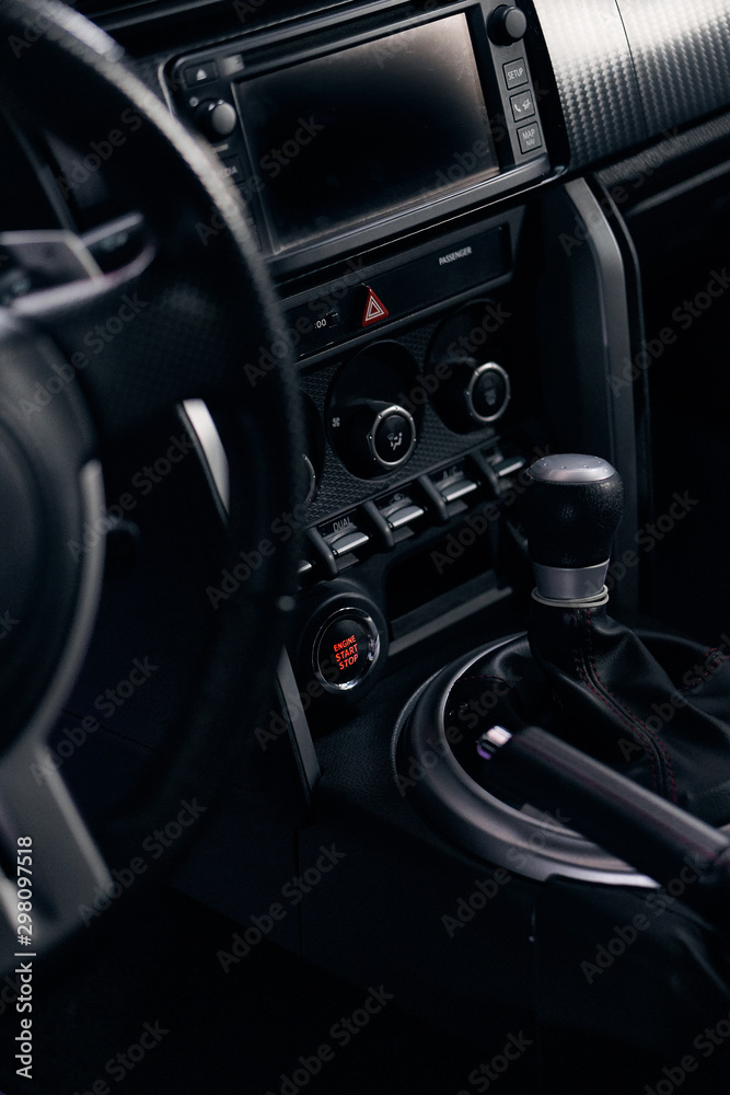 the dashboard and the gear lever of a sports car the dashboard and the gear lever of a sports car