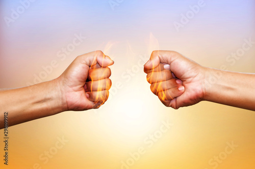 Two hands in air bumping together