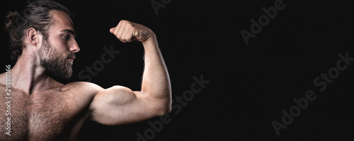 Muscular man doing a biceps pose panorama