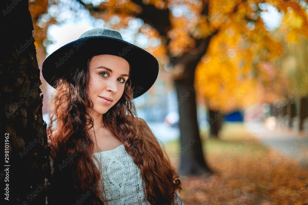 Young woman walking outdoors in autumn enjoying weather Young woman walking outdoors in autumn enjoying weather