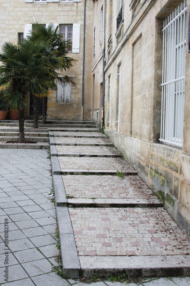 cobblestone stairway on the square Palais Gallien in bordeaux city  France
