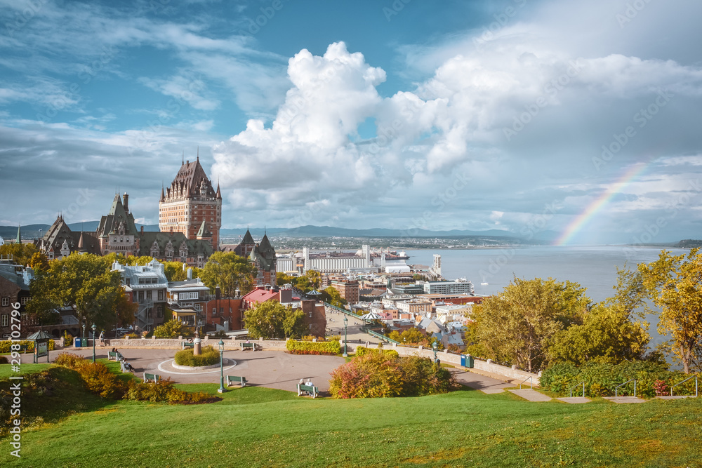 Panoramic Cityscape of Quebec in autumn. Sunny cloudy day, and rainbow over the river. Quebec, Canada.