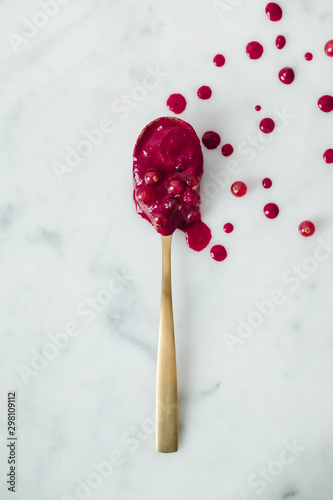 golden spoon with currant coulis